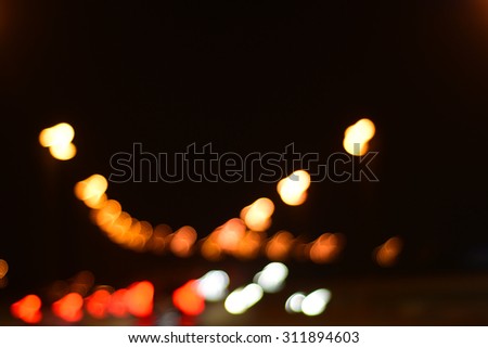 Blur image of Putrajaya Highway at night with bokeh.