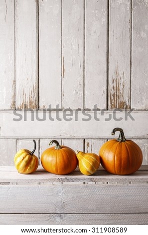 Pumpkins on wooden table, copy space