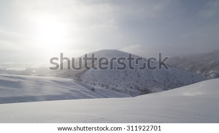 dawn sun in the snowy mountains