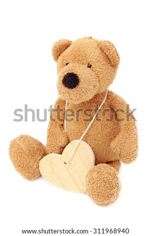 Conceptual image of teddy bear with heart symbol isolated