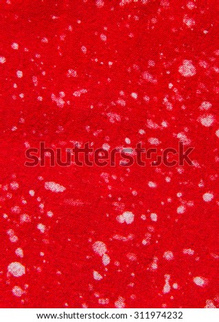 White spot on red fabric.
