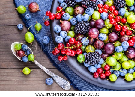 Berries fruits background. Antioxidants, detox diet, organic fruits background. Royalty-Free Stock Photo #311981933