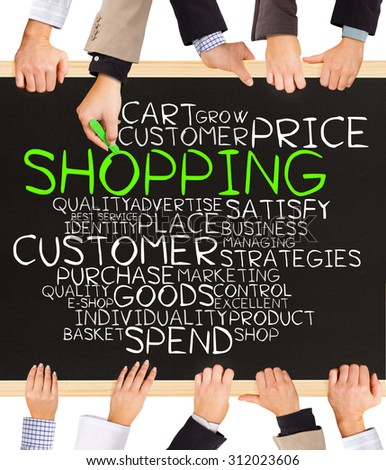Photo of business hands holding blackboard and writing SHOPPING concept