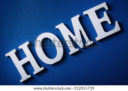 White letters with word HOME