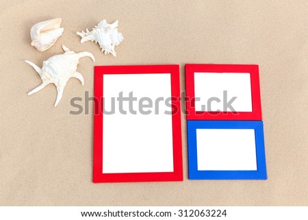 It's time to update your vacation photos,Shells, colored stones and photo frames, all of them are a reminder about a  vacation,photo frame on the beach, photography on the beach,beach vacation, 