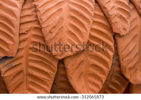 Clay tile made of leaves.