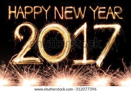 Happy new year 2017 written with Sparkle firework Royalty-Free Stock Photo #312077396