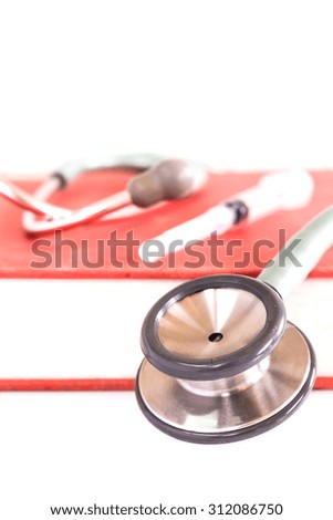 Close up Stethoscope and textbook therapeutic