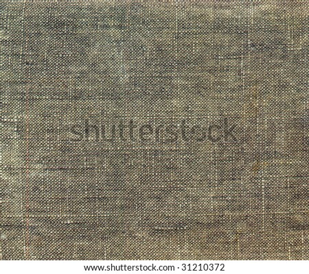Grunge background of tattered green army camouflage tarpaulin.