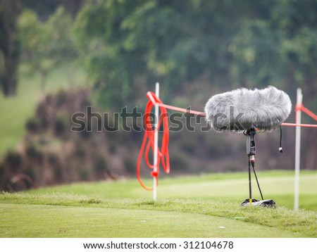 windshield microphone standing in golf course