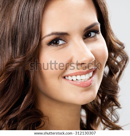 closeup portrait of smiling beautiful young woman