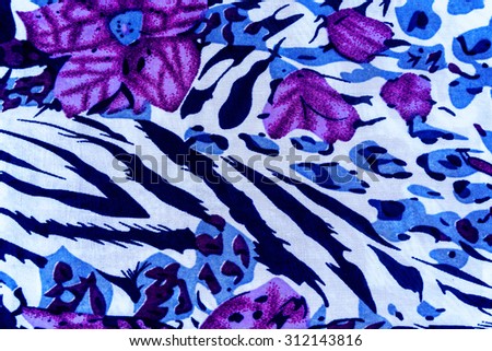 texture fabric of tiger prints and decorative roses