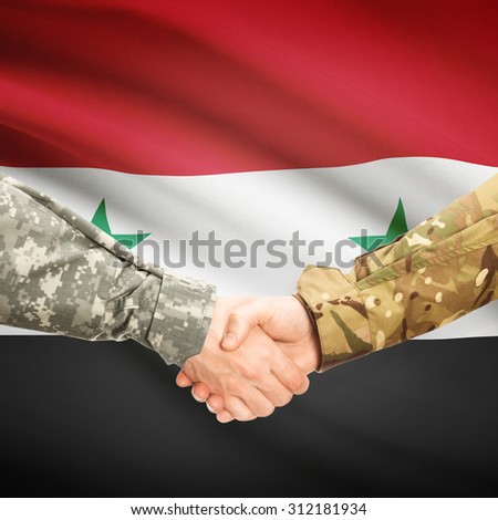 Soldiers shaking hands with flag on background - Syria