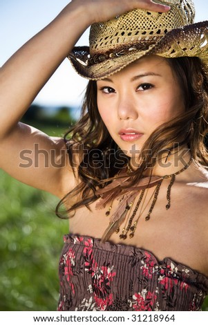 A shot of a beautiful asian girl outdoor