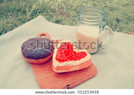  Picnic for a summer vacation with donuts with milk