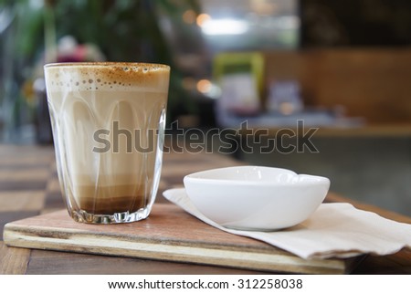 Hot latte art coffee on wooden table  Sugar is sweet 