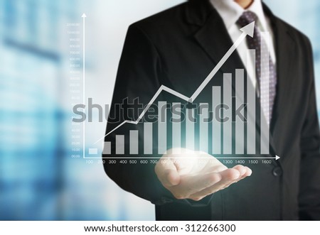 businessman with financial symbols coming from han