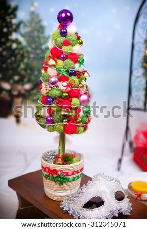 Christmas tree, handmade from sisal and carnival mask