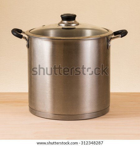 stock pot on wooden table