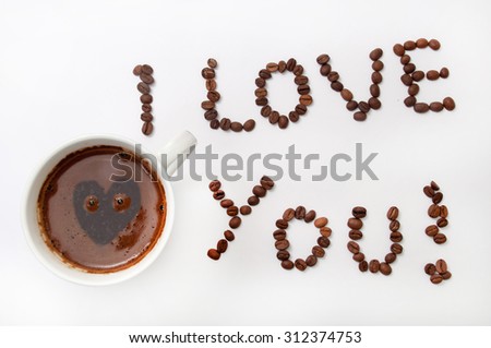 I love you sign with coffee beans and cup of coffee over white background.