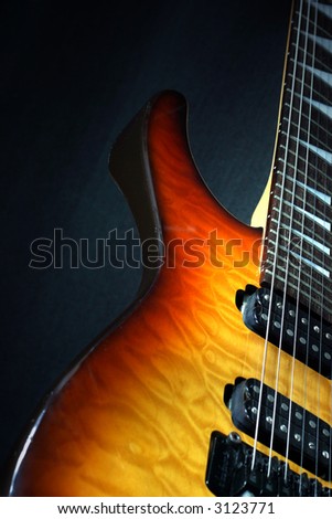 close up electric guitar on a black background