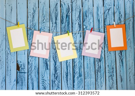 Blank photos hanging on a clothesline
