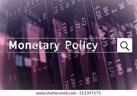 Monetary policy written in search bar with the financial data visible in the background. Multiple exposure photo.