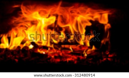 wood burning in an open pizza oven - picture blurred on purpose using a gaussian blur filter in photoshop