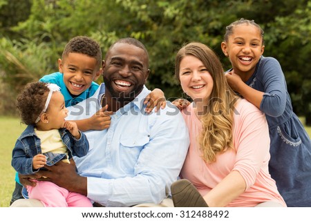 Beautiful diverse family. Royalty-Free Stock Photo #312488492