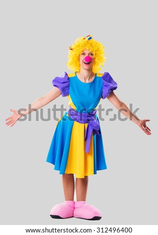Girl in clown's costume with open hands