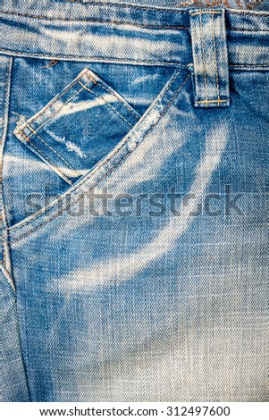 Worn light blue jeans fabric with pocket background  