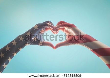 United States of America - USA American flag pattern on people hands in heart shaped  Royalty-Free Stock Photo #312513506