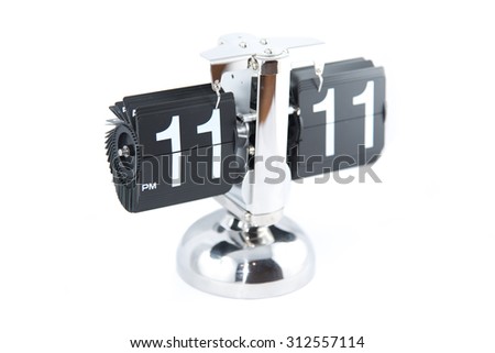 Isolated vintage style flip clock on white background at 11:11
