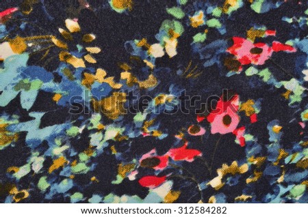 Floral pattern with painted spots on fabric. Colorful abstract flower print as background.