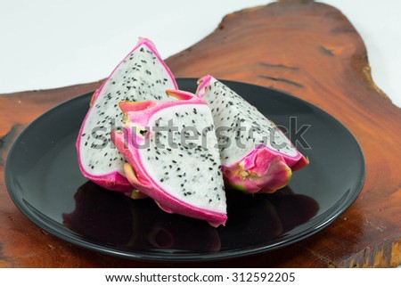 Dragon Fruit clos-up  on dish and wood background