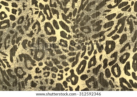 Black and yellow leopard fur pattern. Spotted animal print as background.