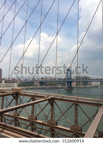View of Manhattan Bridge from the Brooklyn Bridge walking path.