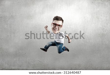 Funny picture of running man with big head over cement background