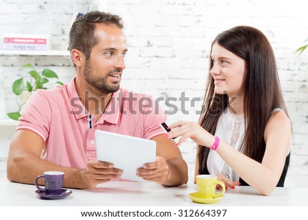 a young couple go shopping on internet