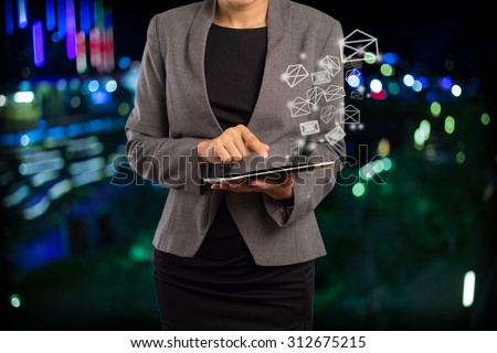 Business woman sending email by using digital tablet