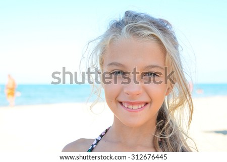 blonde young girl on the beach