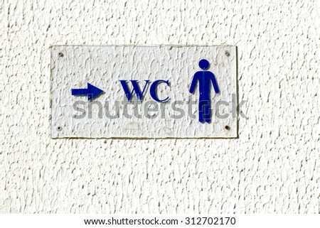 plaque on the wall pointer WC