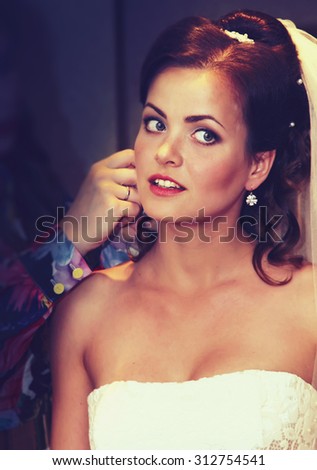 Beautiful bride preparing to ceremony vintage style filtered picture