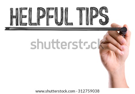 Hand with marker writing the word Helpful Tips