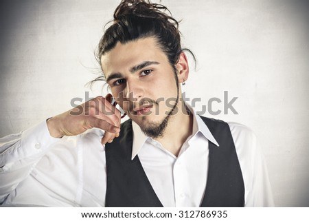 Young man showing calling sign