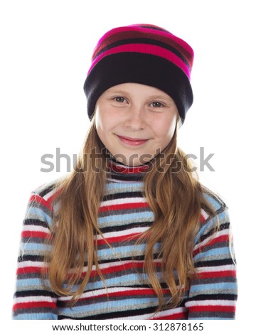 Beautiful girl in colored striped hat and sweater on a white background.
