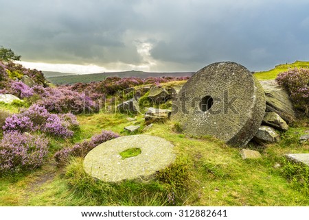 Abandoned Mill Stones at Burbage Edge, Hathersage Moor in Peak District National Park, Derbyshire, England, UK Royalty-Free Stock Photo #312882641