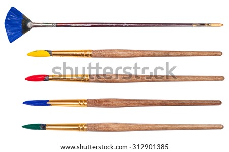 set of round artistic paintbrushes with painted tips isolated on white background Royalty-Free Stock Photo #312901385