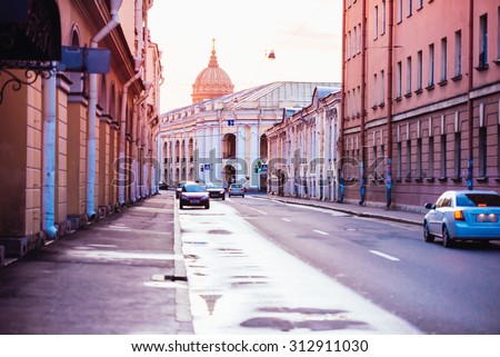 Street with old beautiful buildings in historical center during summer white nights in Saint Petersburg, Russia. Toned picture