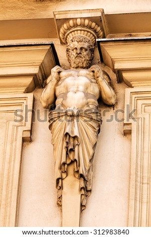 stone facade on classical building with ornaments and sculptures